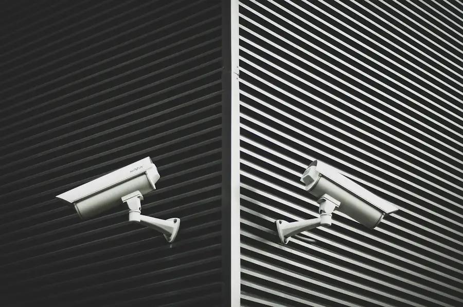 Two security cameras on a modern facade