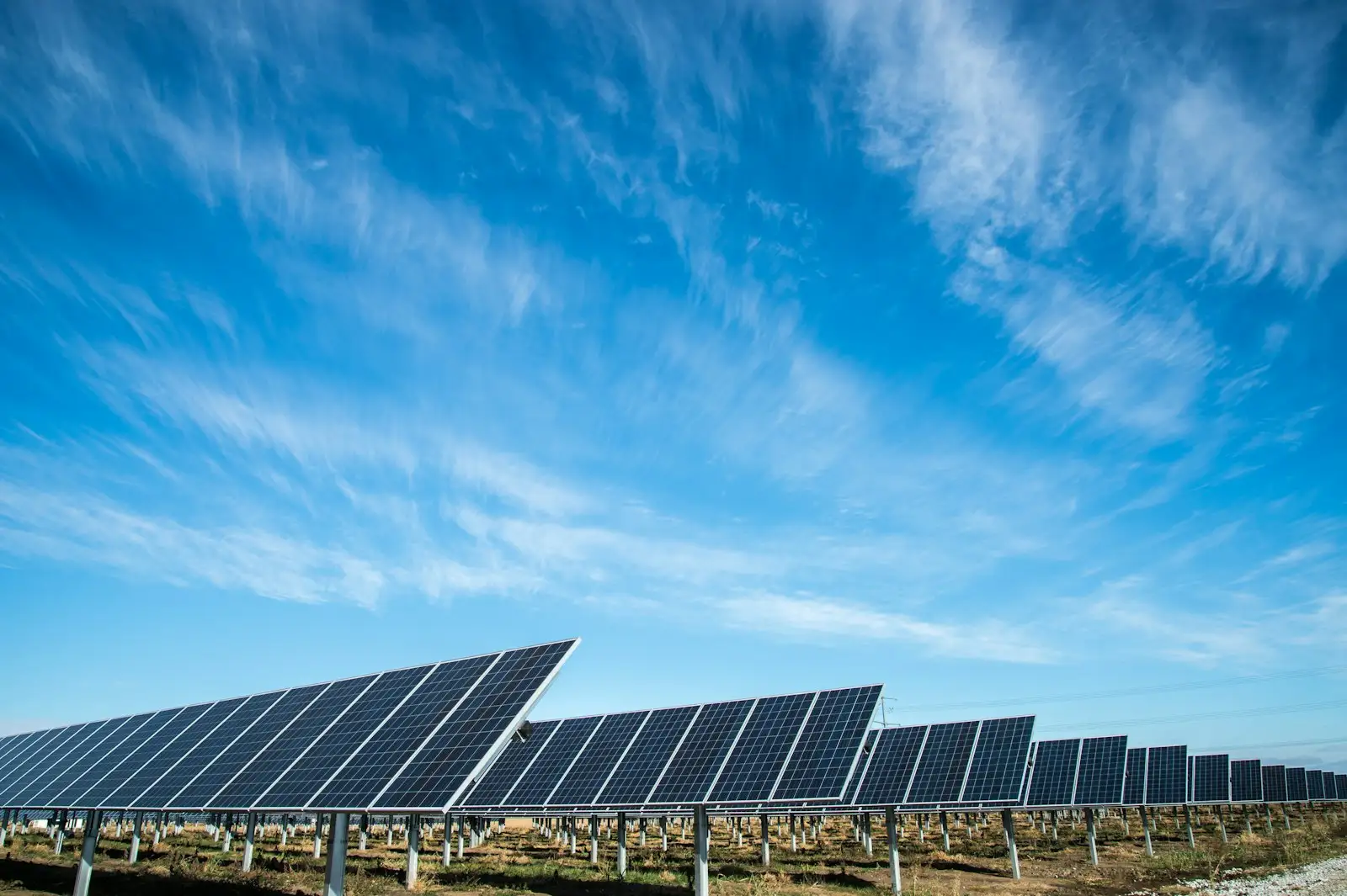 Solar panel array under a blue sky
